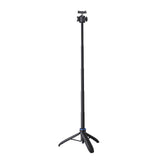 Selfie stick extended on its tripod legs with phone clamp on the ball head