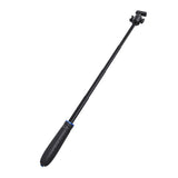 Selfie stick fully extended, seen diagonally with its grip at the bottom