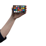 Calibrite ColorChecker Classic Mini handheld to show size