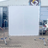 PiXAPRO 300x300cm Butterfly Frame Sun Shade Scrim Diffuser on a metal stand with wheels outdoors