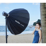 A Godox AD300proII Portable Battery Flash being used to photograph a model with a softbox attached