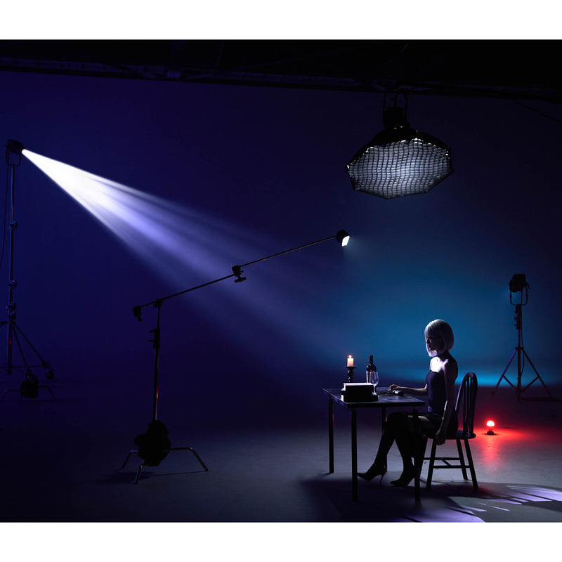 GODOX KNOWLED BP36K Projection attachment being used to illuminate a person at at table