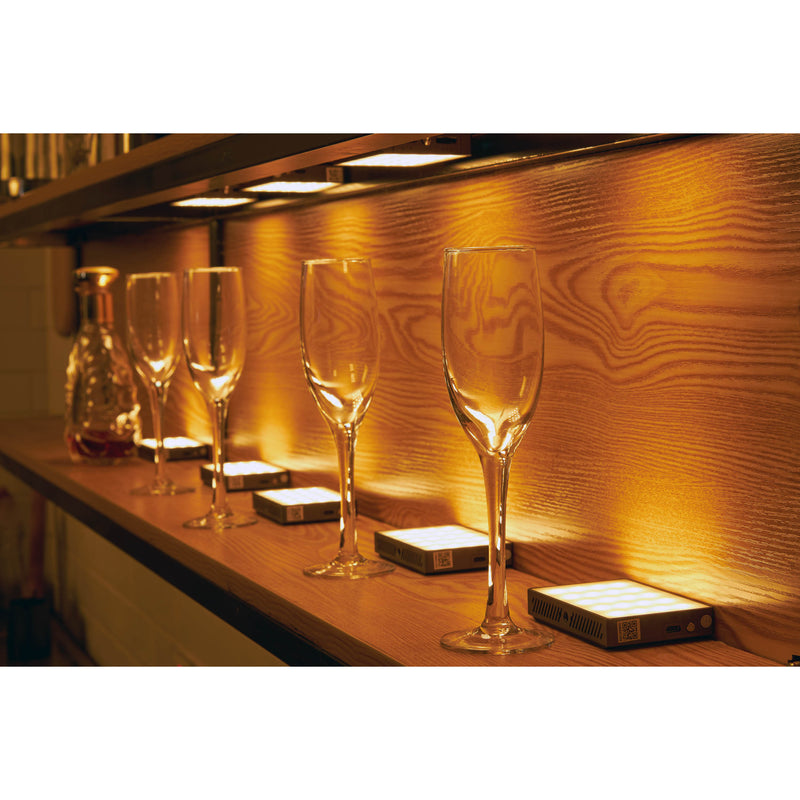 GODOX C5R K8 8-LIGHT-KIT being used to illuminate wine glasses on a bar set
