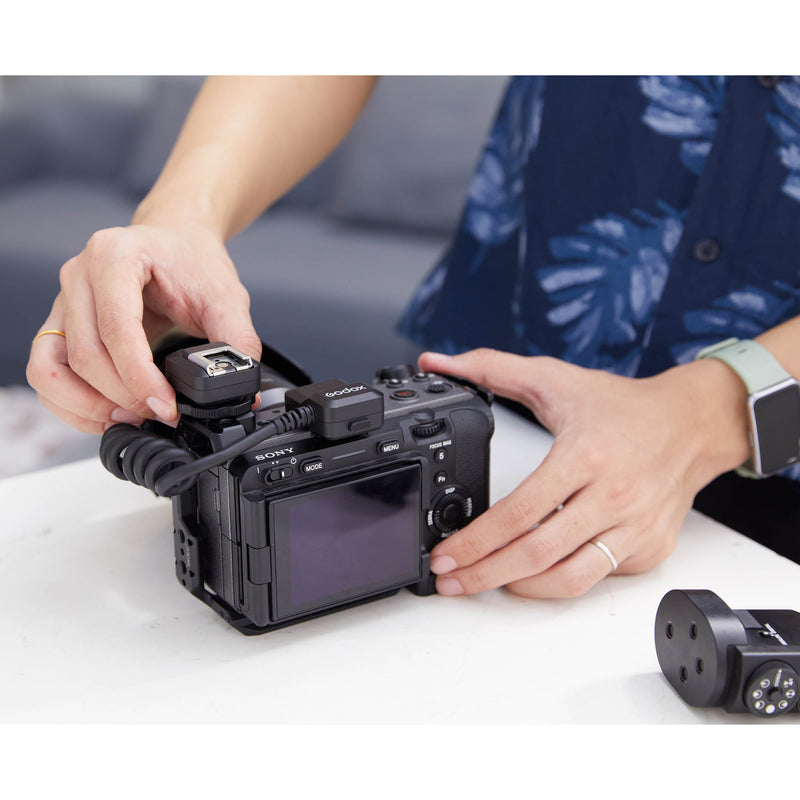 Godox GAC-IC13 Hotshoe Extension Cable being mounted to a camera
