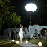 GODOX KNOLED GL7 7-Foot G-Mount Lantern Diffuser being used to illuminate an outdoor set at night