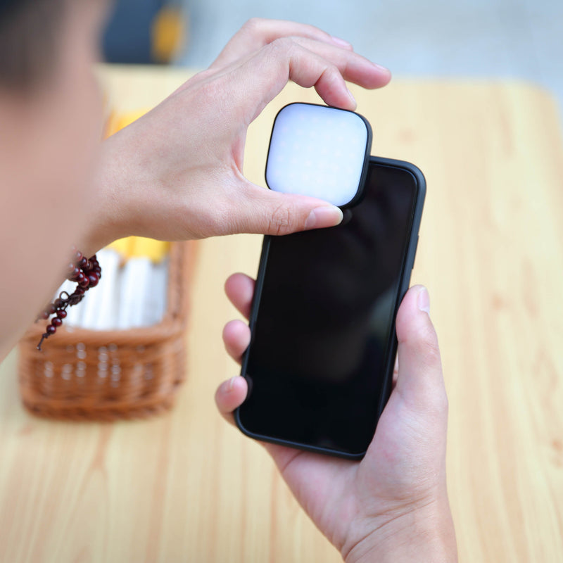 GODOX LEDM32 Clip-On Smartphone LED  Light being mounted onto a smartphone