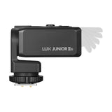 Godox Lux Junior II flash showing the range of tile motion thet flash head has