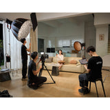 TWO GODOX KNOWLED M600R RGBWW COB LED STUDIO LIGHTS BEING USED TO ILLUMNATE AN INDOOR SCENE