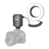 Camera flash and  ML-150II ring flash on a white background
