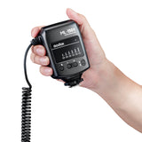 Hand holding a Godox ML-150II Ring Flash controller on a white background