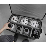 Lights and accessories being placed into a Godox SC27 Roller case