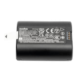 Black battery with GODOX branding and label on a white background