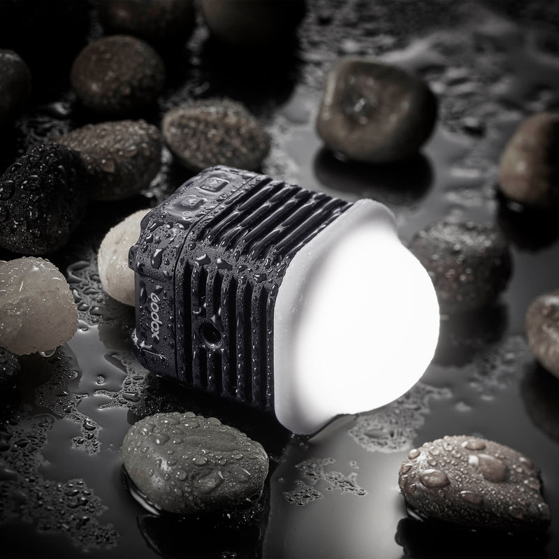 GODOX WL4B  IPX8 Waterproof LED Surrounded by water and pebbles