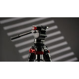 iFootage Gazelle TA3B Tripod + Komodo K3 Head Bundle on a grey background with a window blind pattern  projected onto it