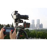iFootage Motion X2 Simple Slider mounted to a tripod with a camera on it outdoors