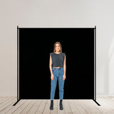 Large Black Single Panel Folding Portable Photography Backdrop with Stands Model Posing Infront of Background