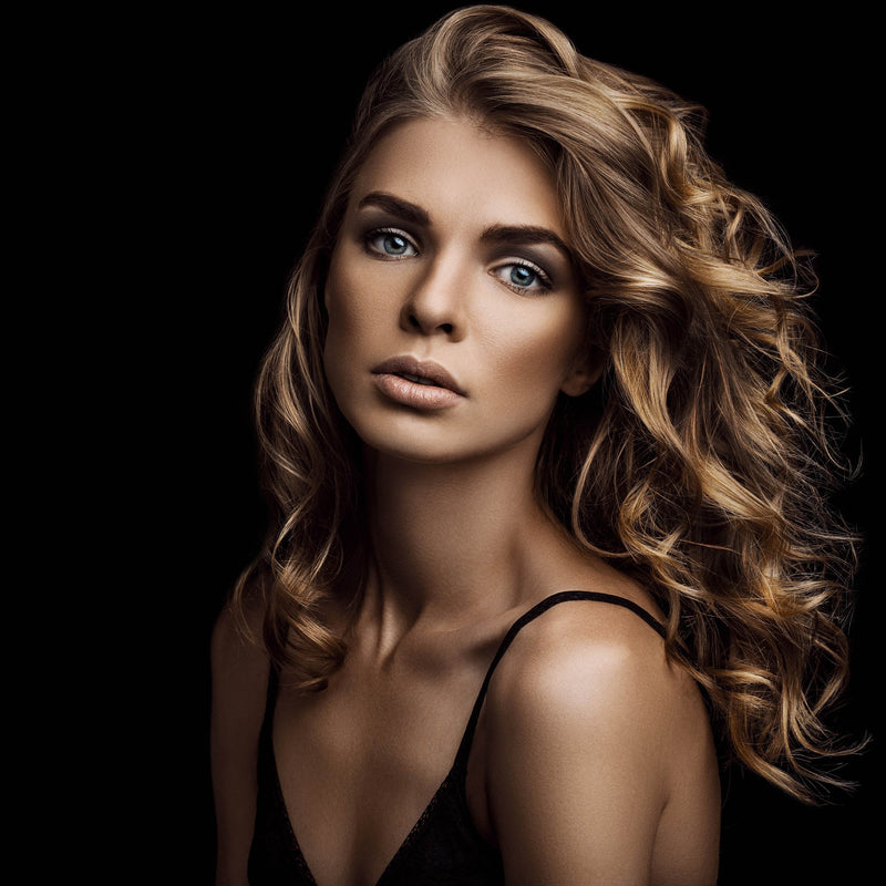 Model in front of a PiXAPRO 2.7x10m Black Seamless Paper Background Roll