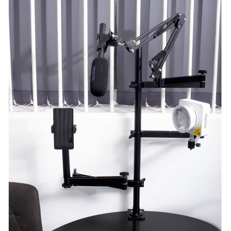 PiXAPRO Tabletop Gear Tree Clamp Sand mounted to a table with microphone, light and smartphone mounted to it