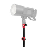 A close up of the PiXAPRO RapidStand 225 Light stand with a studio flash fixture mounted to it