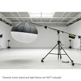 The 222-370cm Heavy-Duty Geared Junior Boom Crane Arm mounted to a junior geared stand with a large lantern mounted to it in a large studio environment