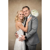 Man in a grey suit and a woman in a white dress posing together against a 2x3 Abstract Brown Beige Little Green Colour Studio Microfibre Photography Backdrop By Kate Backdrops