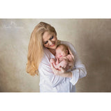 A Woman holding a newborn baby against a 2x3 Abstract Brown Beige Little Green Colour Studio Microfibre Photography Backdrop By Kate Backdrops