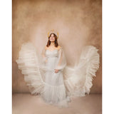 A woman in an angel costume with a flowing white dress and wings against a 2x3 Abstract Brown Beige Little Green Colour Studio Microfibre Photography Backdrop By Kate Backdrops
