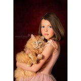 Young girl holding a fluffy orange cat against a 2x3 Dark Red Wine Colour Abstract Weave Pattern Texture Studio Photography Background from Kate Backdrops