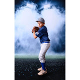 A you boy wearing baseball attire in front of a Sweep Sports Stadium Lighting Backdrop  with a baseball mitt