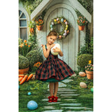 A young girl ina tartan, standing in front of an Easter House Bunny Garden Carrots Backdrop