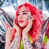 A Studio photograph taken using the PiXAPRO Reflective PET roll of a model in colourful hair an makeup. Photo by Ian Phillips