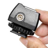 A person holding a PiXAPRO Universal PC Sync Adapter, Showing its PC Sync Port