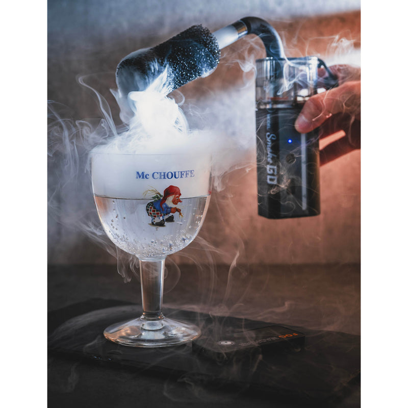 LensGo Smoke Go Compact Portable Fog Machine being used on a beverage shot