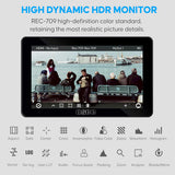 High dynamic HDR monitor with screen displaying a cityscape and people on a bench, featuring the OSCC brand.