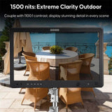 OSOEE monitor displaying an outdoor scene with a table and chairs, emphasizing extreme clarity and detail.