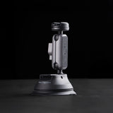 The PGYTECH CapLock Camera mount with a suction cup on a black background