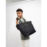 SAKK GEAR Organisational Tote Bag Model holding case over shoulder