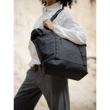 SAKK GEAR Organisational Tote Bag Model on Location with bag over shoulder