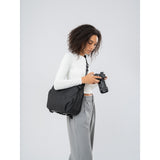 SAKK GEAR Laptop Camera Sling Photography Looking at Camera with Bag over their shoulder