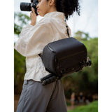 SAKK GEAR 9L Camera Sling Photographer taking shot with case over their shoulder