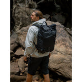 SAKK GEAR 25L Roll Top Backpack On the Back of Photographer in Location