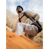 SAKK GEAR Sakk Pack V2 On back of model climbing hill