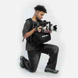 SAKK GEAR Sakk Attach Photographer on Knees holding camera