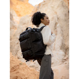 SAKK GEAR Sakk Pack Cube Over Shoulder of Photography on location