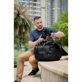 SAKK GEAR Sakk Pack Cube photographer taking camera out of case