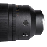 Close-up of a black Sony E-mount SongRaw AF 50mm F1.2 FE Moonlit Lens showing the focus ring, aperture scale, AF/MF switch, and a textured matte finish on a white background.