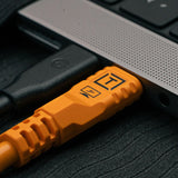 TetherPro Optima 10G USB-C 3.2 High-Visibility Orange Cable (3m Straight to Straight) Plugged into Computer