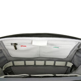 Close-up of the interior of the VEO CITY CB29 6 Litre Cross Body Camera Bag, showing a zippered pocket with a white label, a hook-and-loop strap, and a black zipper.