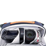 Camera and lens inside a VEO CITY CB29 6 Litre Cross-Body Camera Bag on a white background 