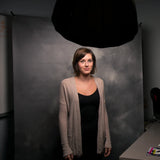 Westcott X-Drop Telescopic Background Support System Being used in a studio to photograph a subject